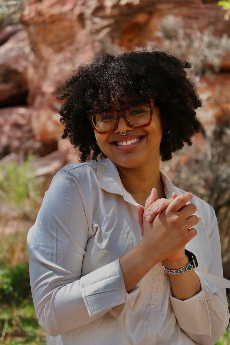 Alyssa Fitch , Fractional CMO and founder of 555 Media & Marketing, posing for a picture.